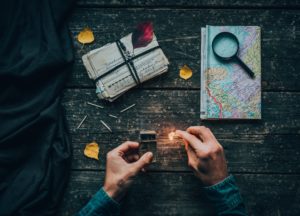 person holding a lighted matchstick